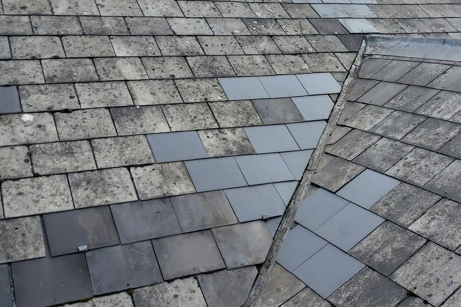 Home Expertly laid natural slate and clay roof tiles on a traditional London property.