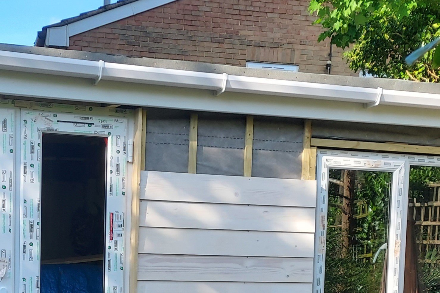Home Clean new white uPVC fascias, soffits, and guttering installed on a house in London.